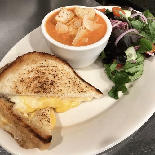 Grilled cheese with a side of soup and garden salad